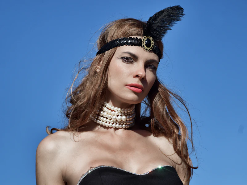 Woman in a 1920s flapper costume with a feather headband