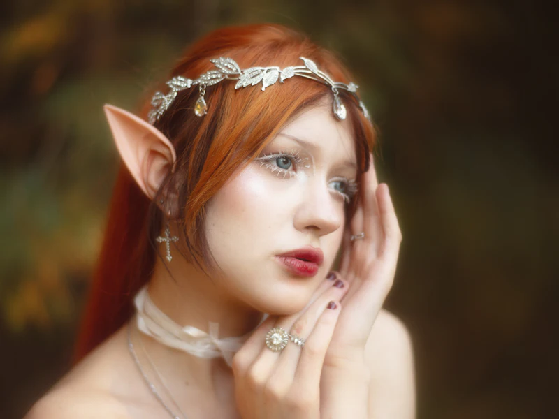 Woman in elf cosplay with pointed ears and a silver headpiece